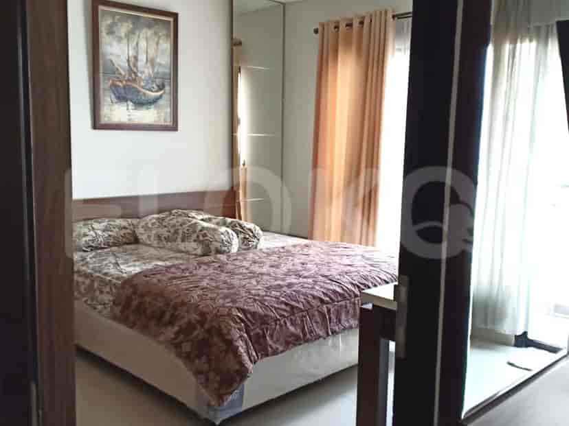 Bedroom featuring a double bed and artwork.