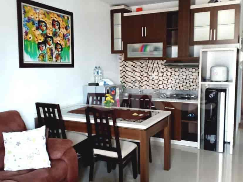 A combined living, dining, and kitchen area.