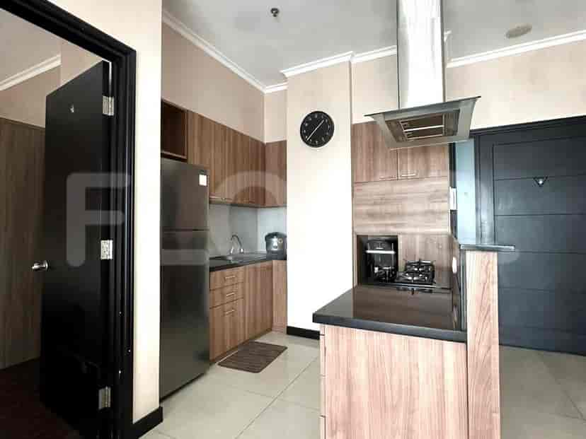 Modern kitchen with cabinets, appliances, and a cooktop.