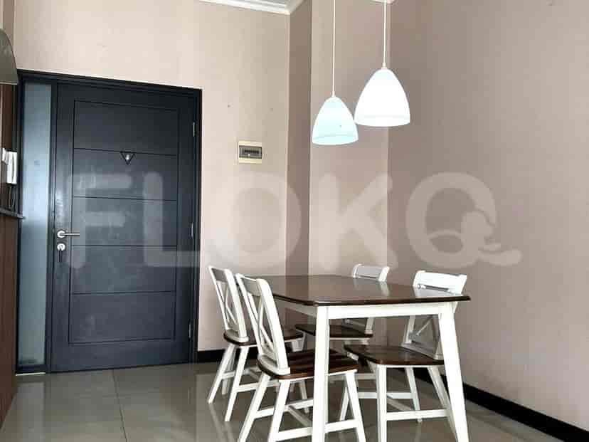 Dining area with a wooden table and four chairs.