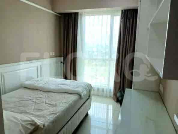 Small bedroom with a single bed, window, and a desk area.