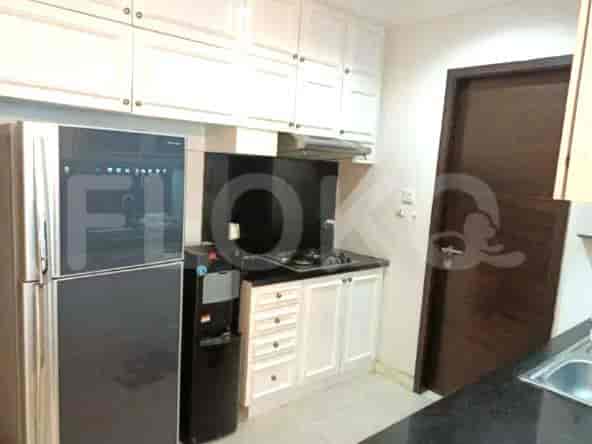Well-equipped kitchen with a refrigerator, cabinets, and a water cooler.