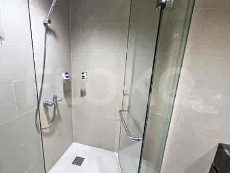 Shower area with glass doors.