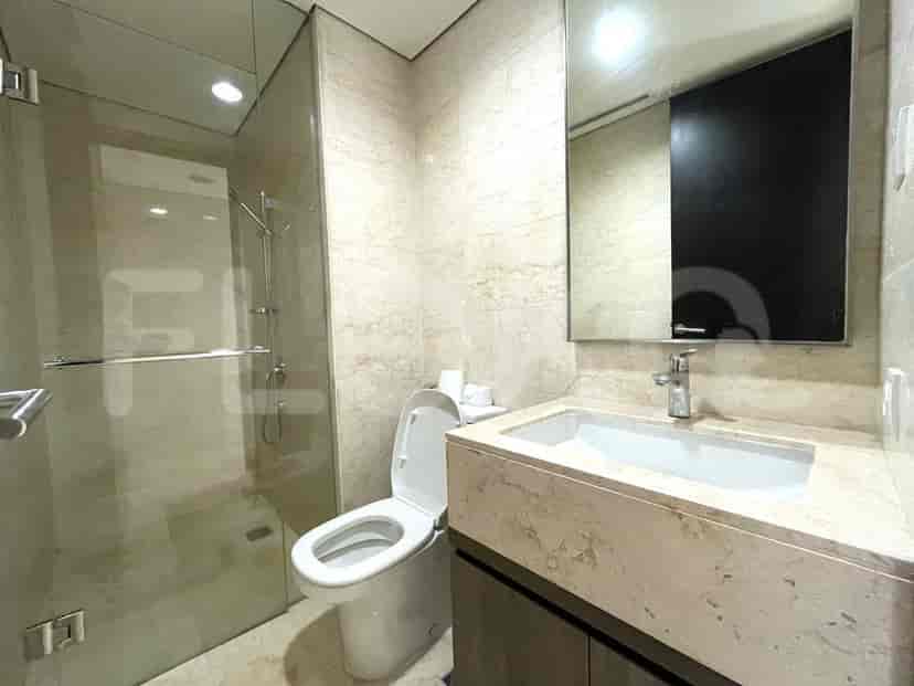 A modern bathroom with a shower and a toilet.
