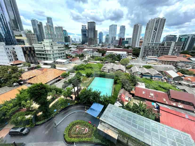 A view of the city from an apartment balcony.
