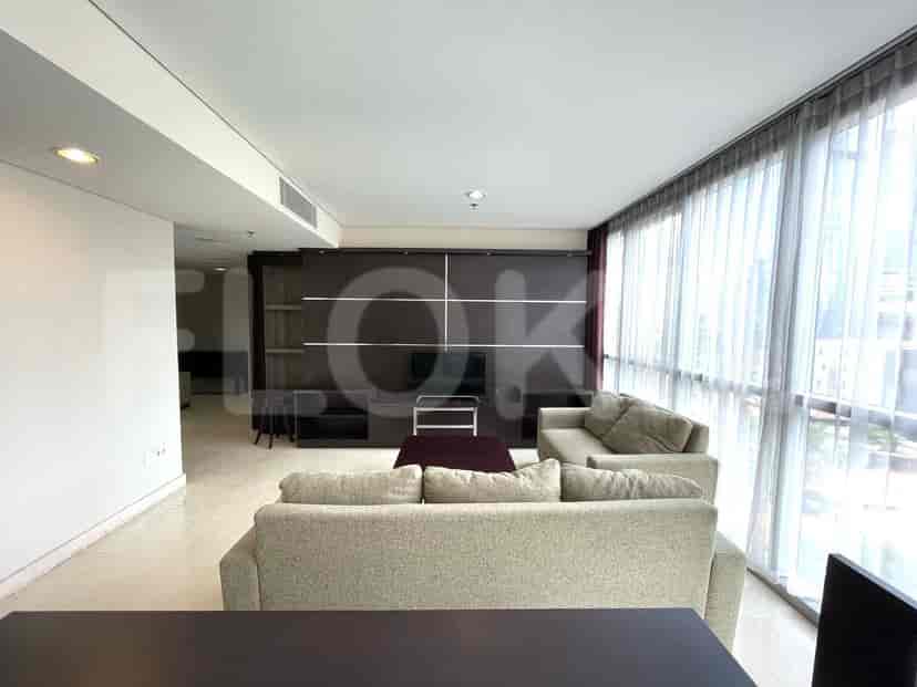 Living room with a sofa, a low coffee table, and a TV unit.