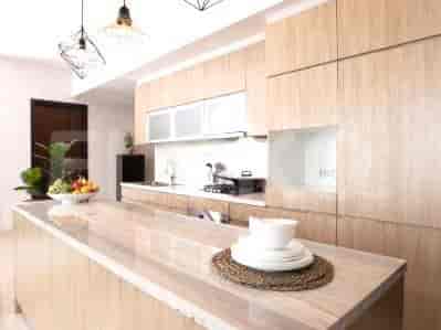 A well-lit kitchen with sleek cabinetry and modern appliances.
