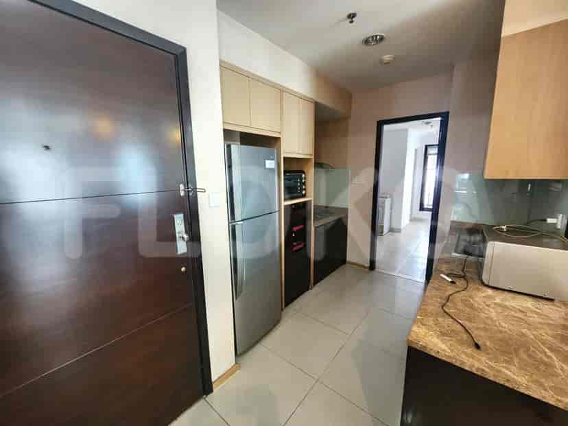 A modern kitchen with stainless steel appliances.