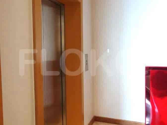 Elevator area with an elevator and a red object.