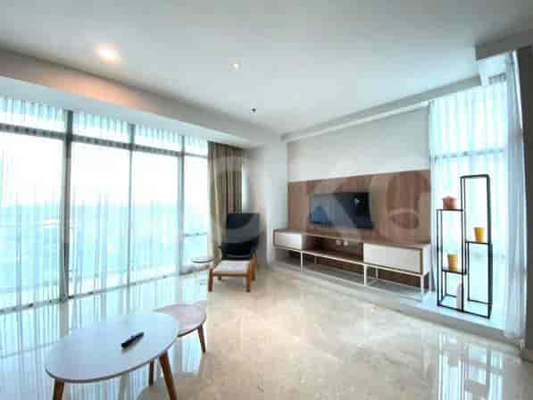 Modern living room with floor-to-ceiling windows and stylish furniture.