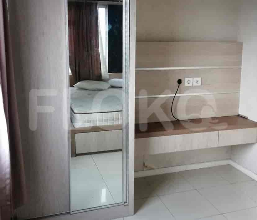 Bedroom with wardrobe and a view.