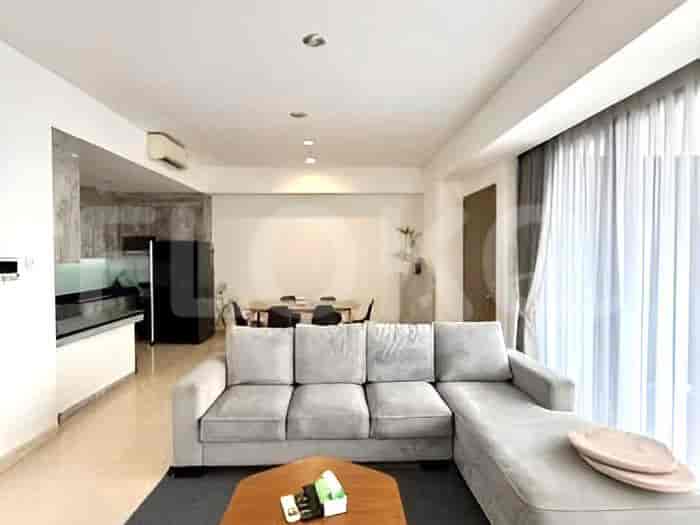 A modern living room with an L-shaped grey sofa and a coffee table.