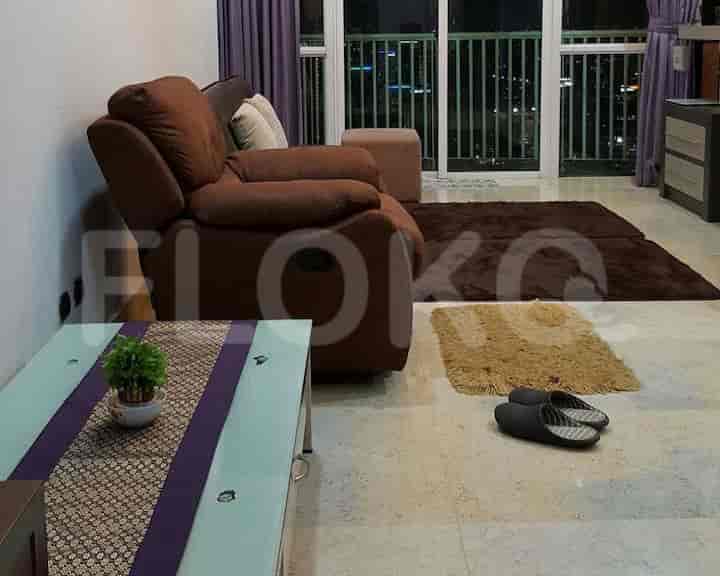 Living room with recliner, coffee table, and rug.