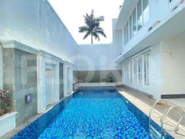 A luxury outdoor space with a swimming pool and a private setting.