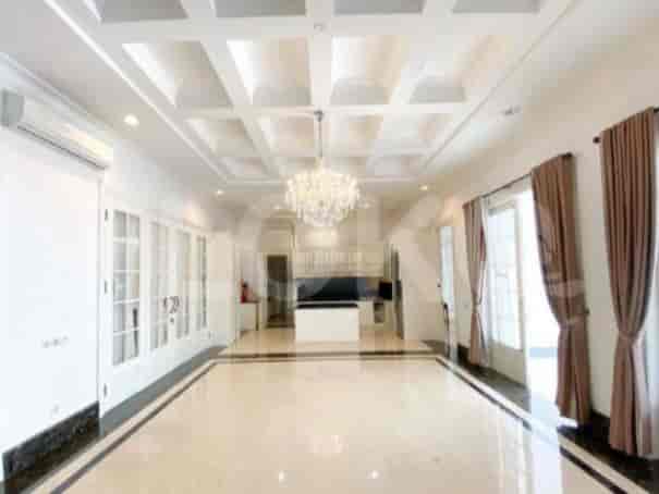 An expansive living room with a coffered ceiling, chandelier, and marble flooring.