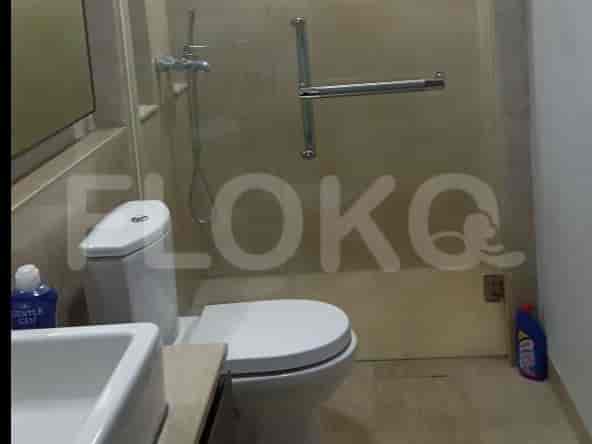 Small bathroom with a toilet and a shower.