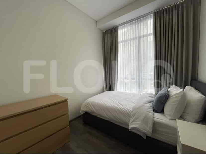 Bedroom with a bed, curtains, and a dresser.