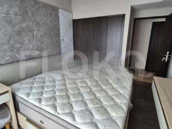 Bedroom with a king-size bed and wardrobe.