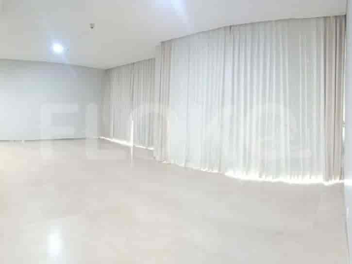 An empty living room with white walls, marble flooring, and curtains.