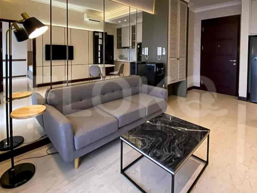 A modern living room with a grey sofa, marble coffee table, and a floor lamp.