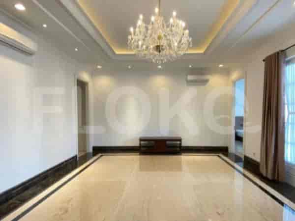 A living room featuring a minimalist aesthetic with a coffered ceiling and a marble floor.