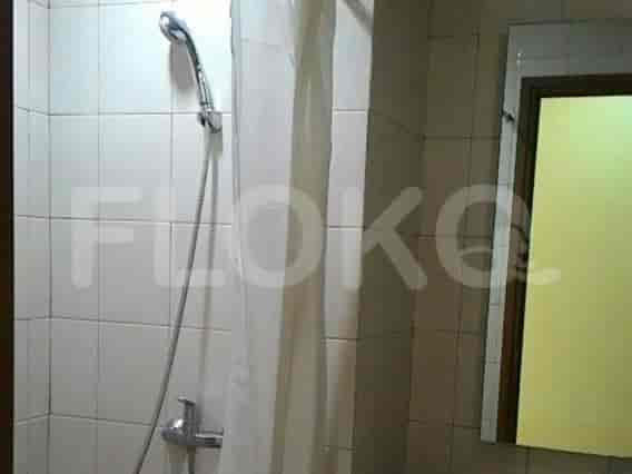 A bathroom with a shower and a shower curtain.
