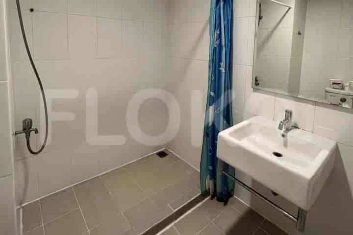 Bathroom with a shower, sink, and mirror.