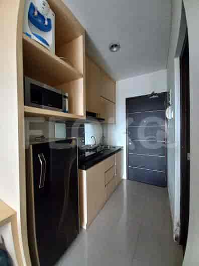A small kitchen space with basic appliances.