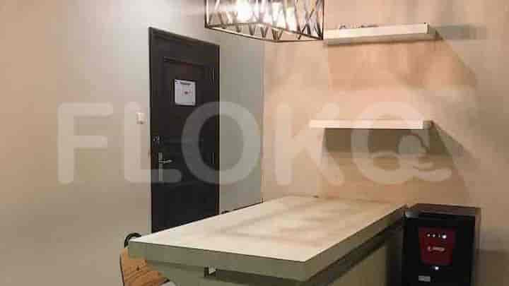 A kitchen area with a stove and refrigerator.
