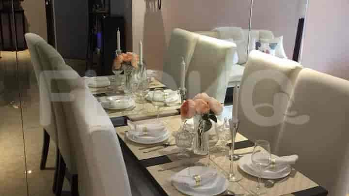Elegant dining room with a table set for a meal.