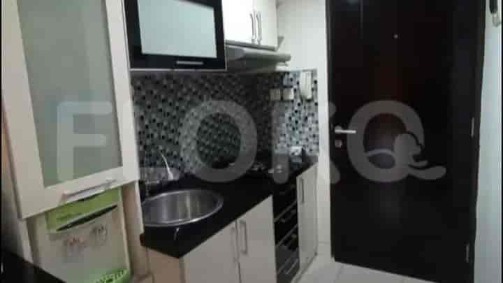 Another view of the kitchen area showing additional storage and appliances.