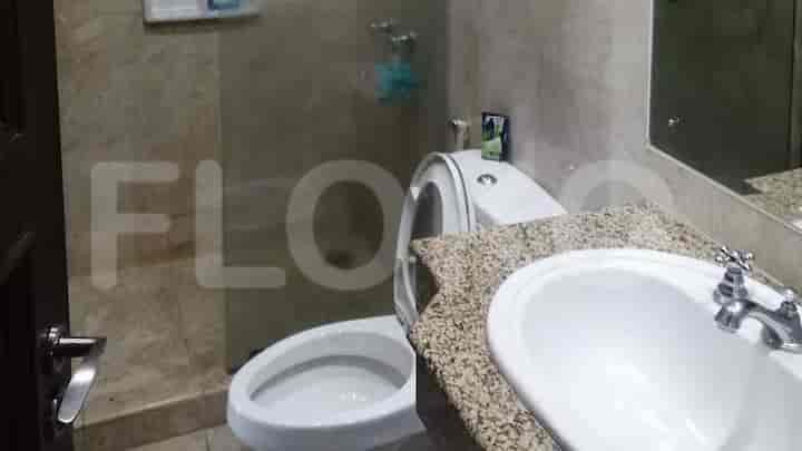 A bathroom featuring a sink and toilet.