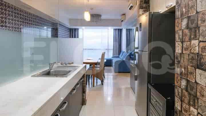 Modern kitchen with stainless steel appliances and counter space.
