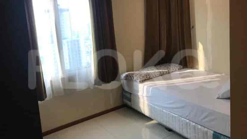 Bedroom with a bed and a window.