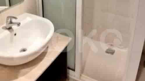 Bathroom with a sink and a shower.