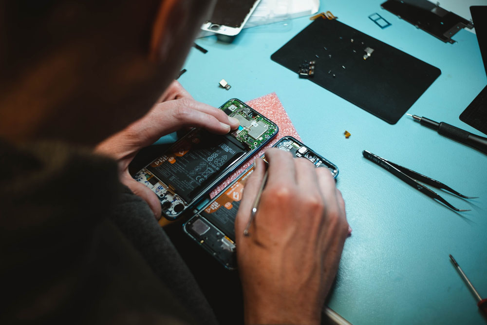 man repairing electronics jakarta