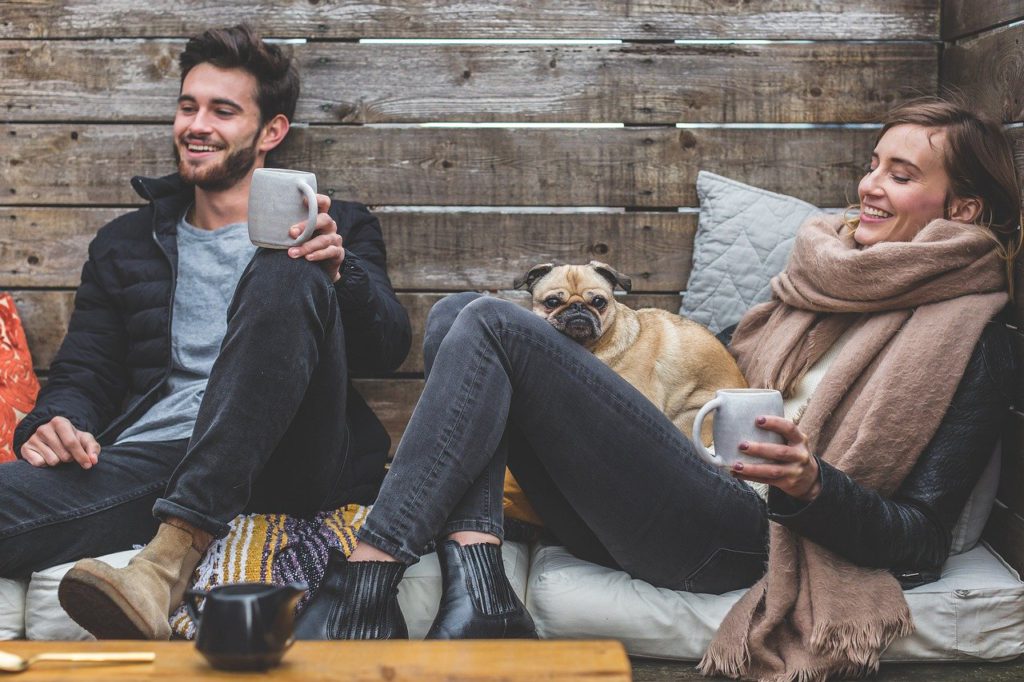 flatmates women held a dog and a man