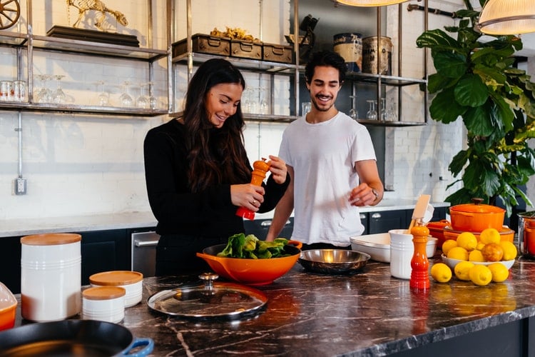 man and women cooking