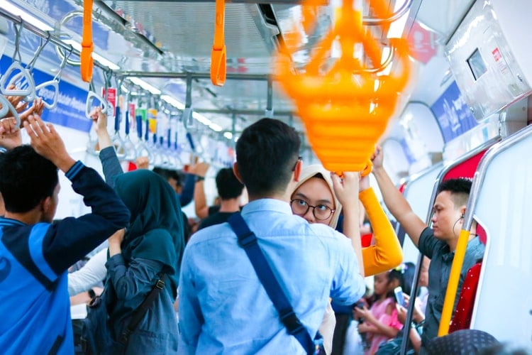 people inside public transportation in jakarta