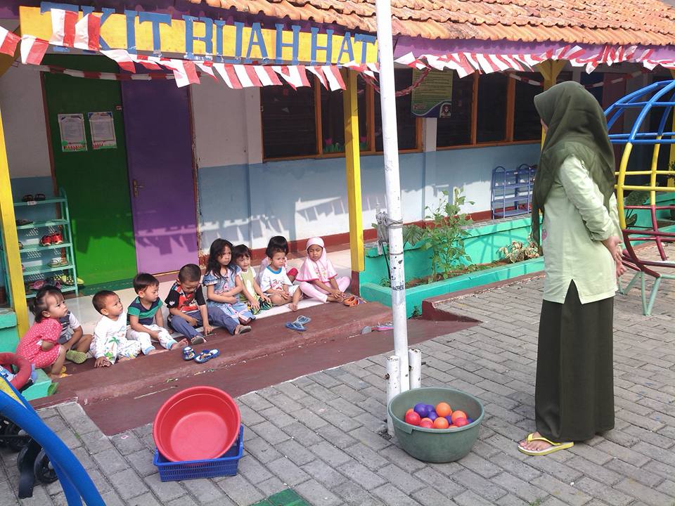 children and their teacher in Little Star Buah Hati Daycare