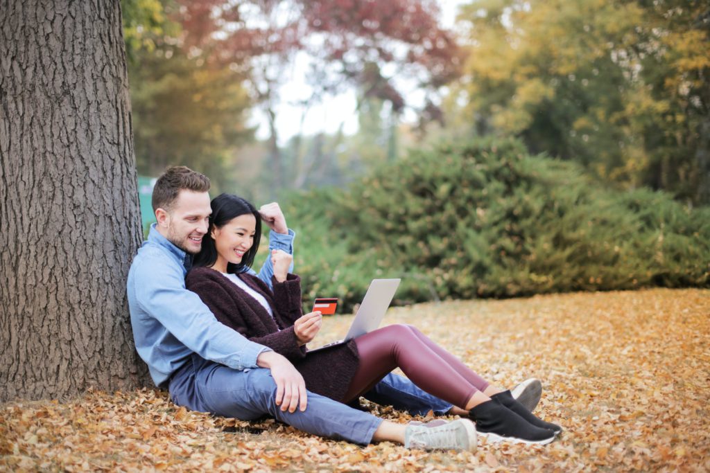 couple sit in park