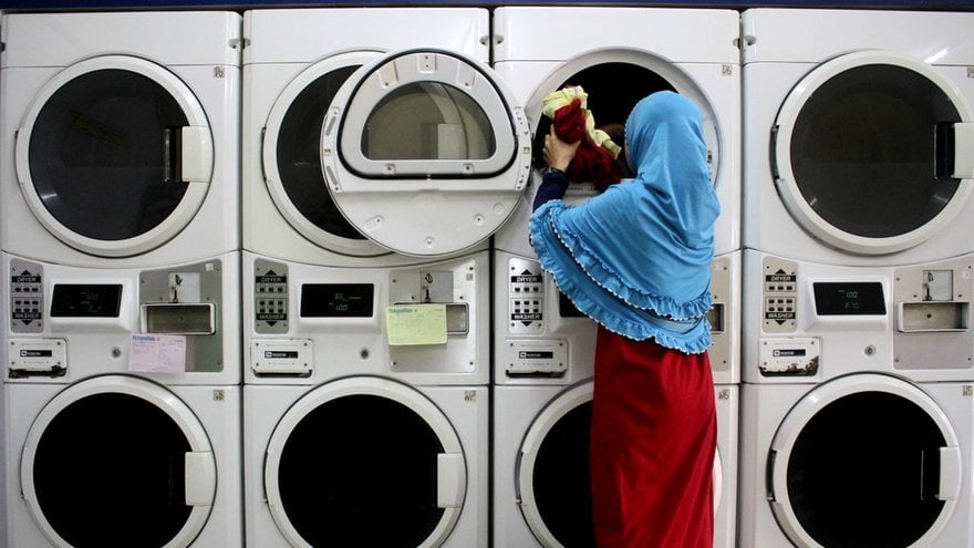 a woman doing laundry services